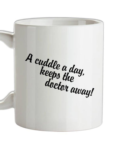 A cuddle a day keeps the doctor away Ceramic Mug